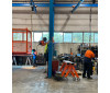 AWB36 Welding Boom Arm Double-Articulated shared between two metal fabrication assembly bays