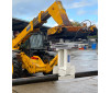FRPS140 Rotating Pole Setter attachment on telehandler