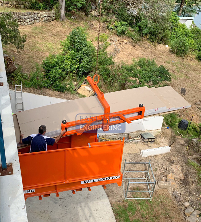 CHW150 Wide Load Pallet Hook - gyprock sheet unloaded by crane at building construction loading platform 