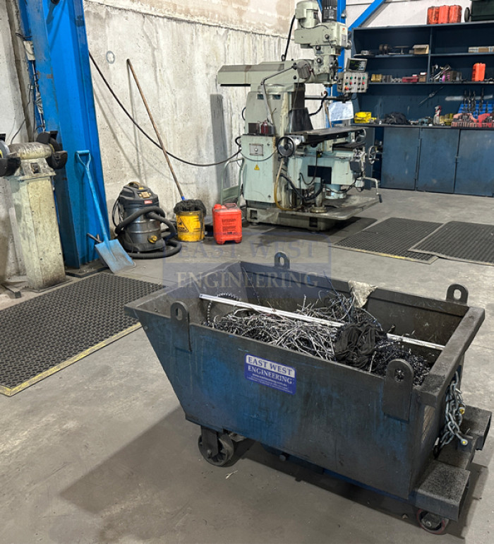 SSD Self Dumping Bin with wheels collecting steel waste in manufacturing facility
